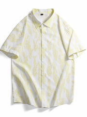 Short sleeve button-up shirt in white with abstract neon yellow pattern, cotton fabric.