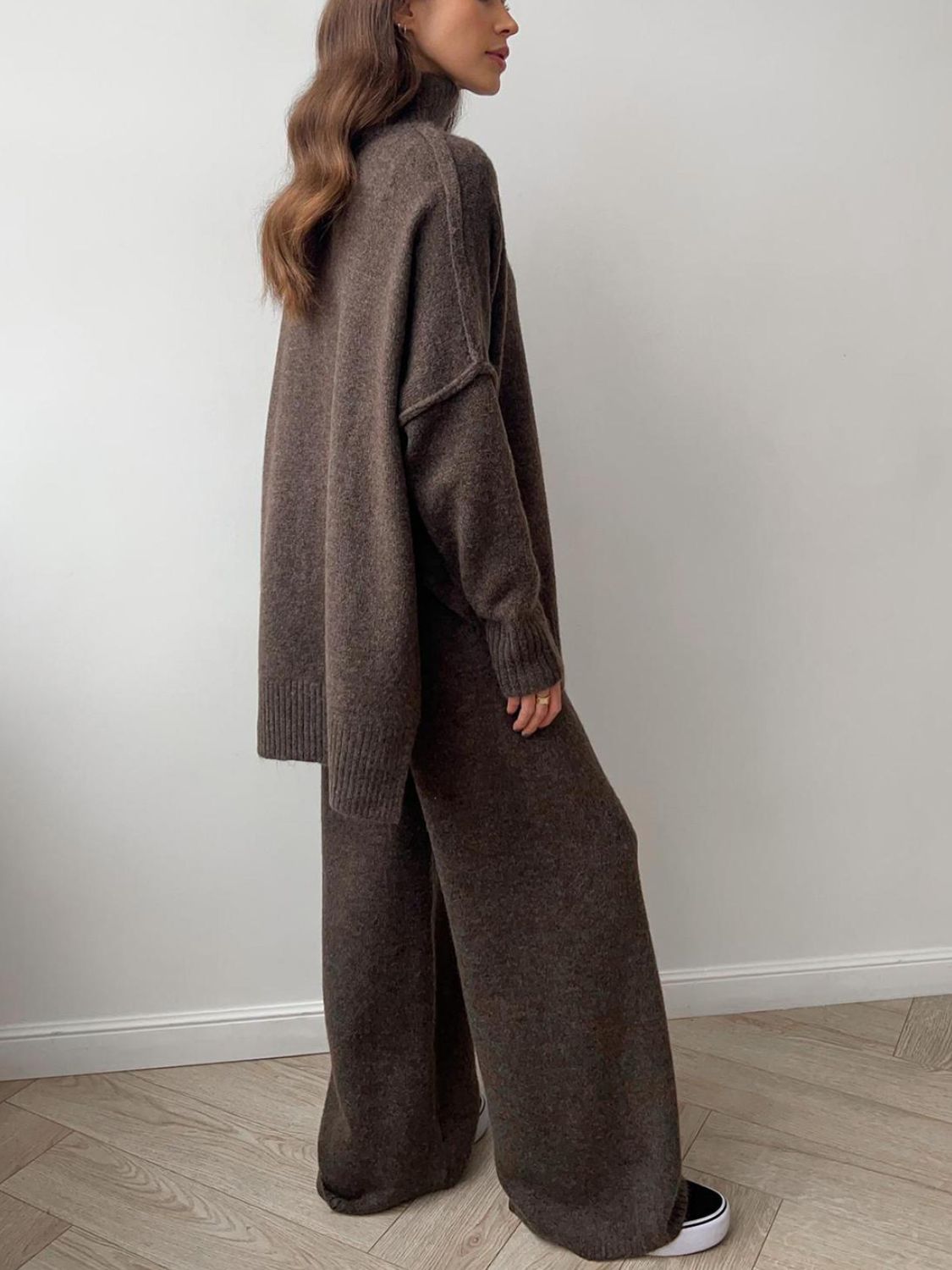 Oversized turtleneck lounge set in coffee brown acrylic with wide-leg pants.