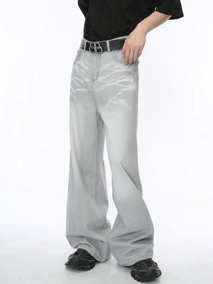 Light wash straight leg denim jeans with whiskered details and a relaxed fit.