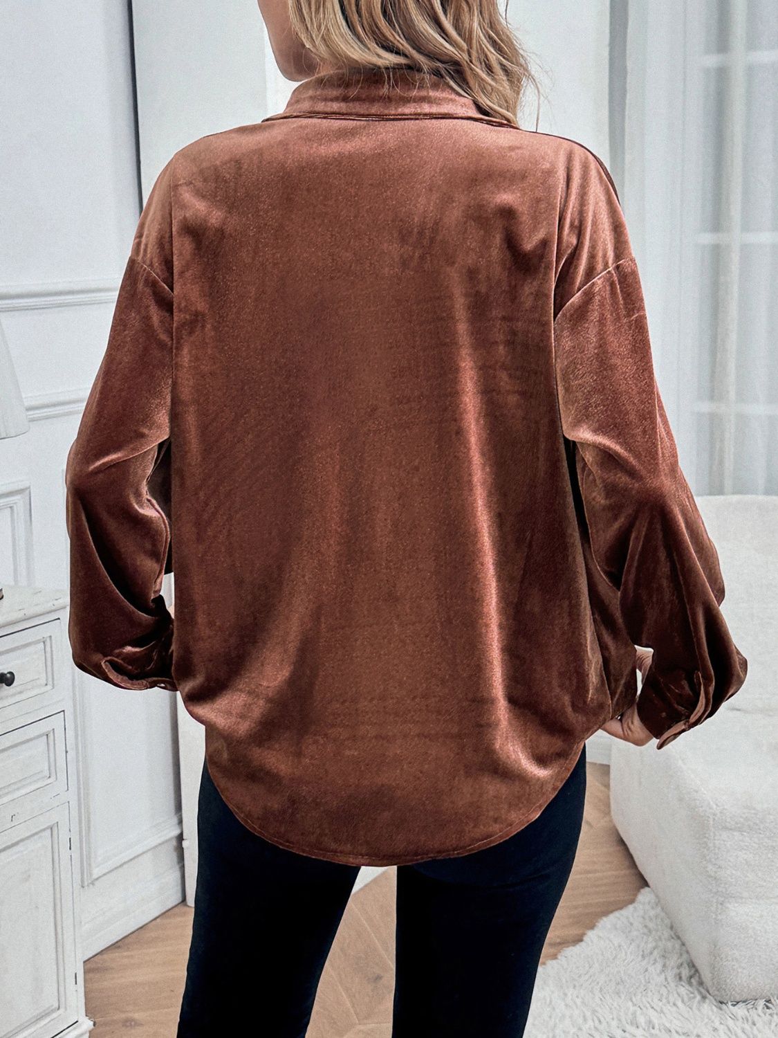 Brown velvet button-up blouse with blouson sleeves.