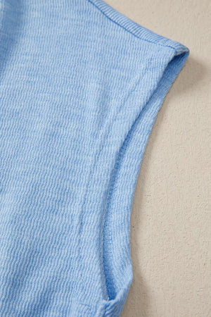 Light blue cap sleeve knit top with textured fabric detail
