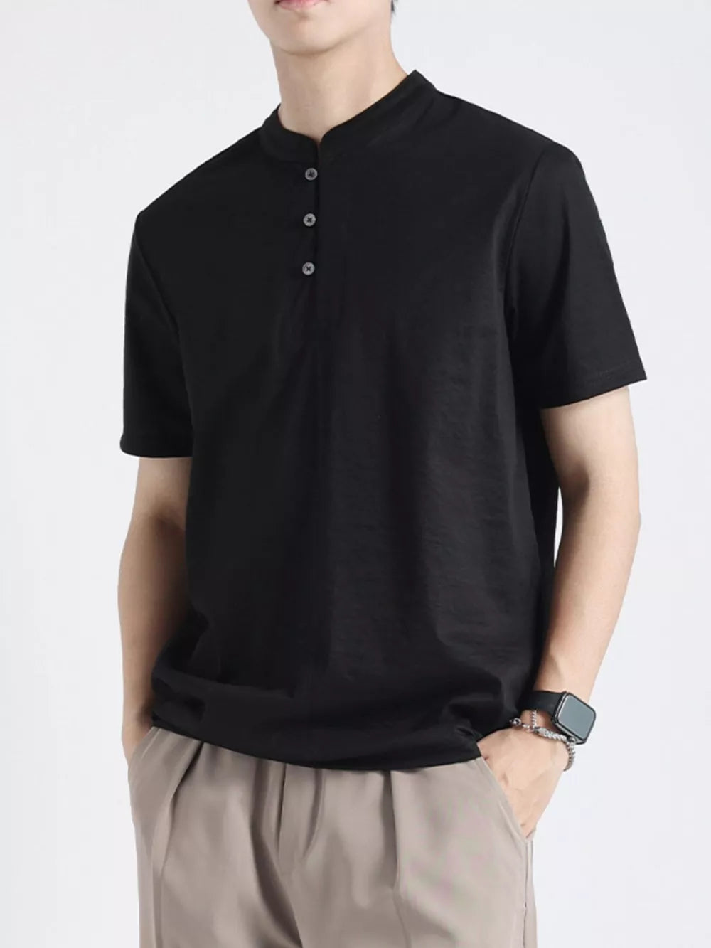 Black buttoned henley t-shirt for men with band collar and short sleeves.