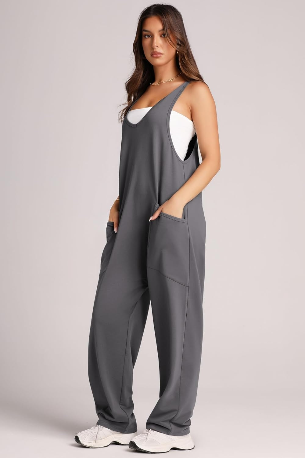 Relaxed fit gray jumpsuit with oversized pockets and V-neck.