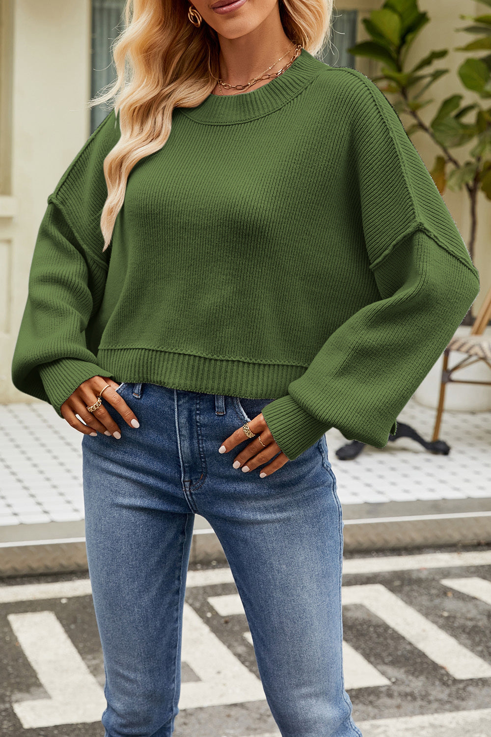 Boxy ribbed knit sweater in dark green with crew neck and relaxed fit.