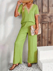 Lime crinkle knit v-neck co-ord set with lace trim and wide leg pants.