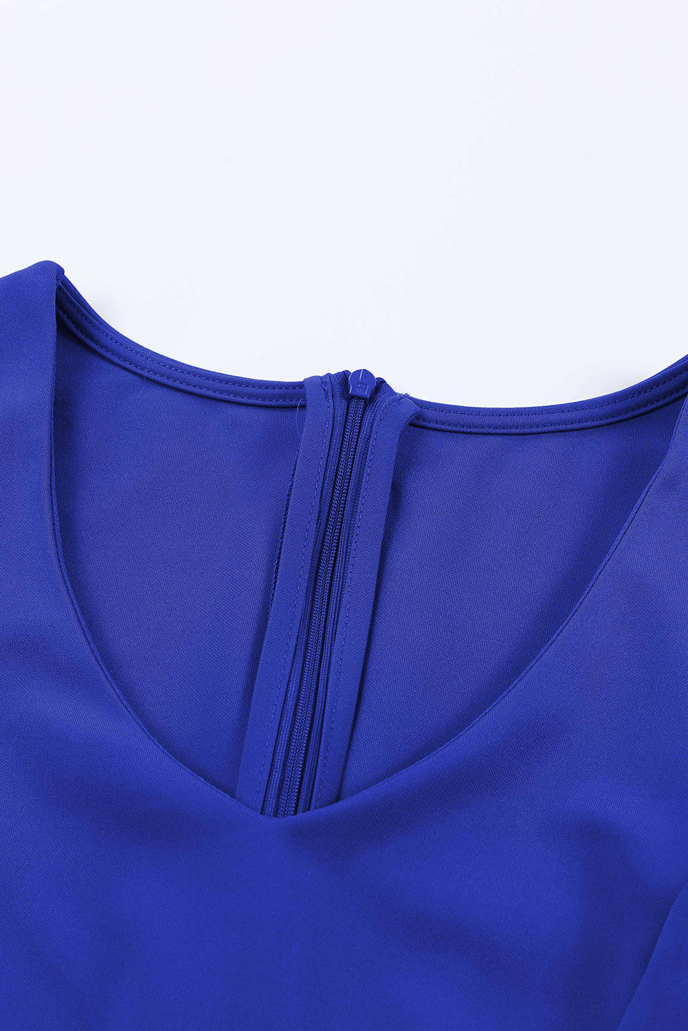 Royal blue jumpsuit with V-neckline and zipper detail