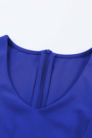 Royal blue jumpsuit with V-neckline and zipper detail