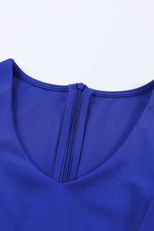 Royal blue jumpsuit with V-neckline and zipper detail