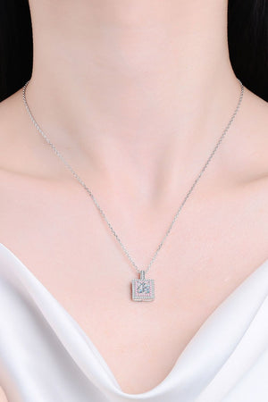 Silver moissanite halo pendant necklace with a square-cut center stone and pave-set accent stones.