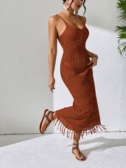 Camel crochet maxi dress with V-neck, spaghetti straps, and a fringe hem.