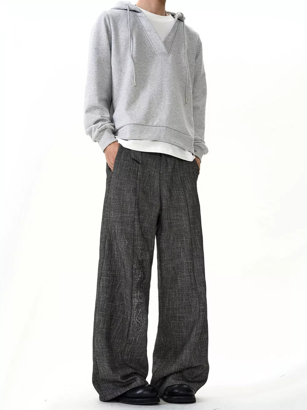 Men's grey textured wide leg sweatpants with a relaxed fit and ankle pooling detail.