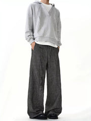 Men's grey textured wide leg sweatpants with a relaxed fit and ankle pooling detail.