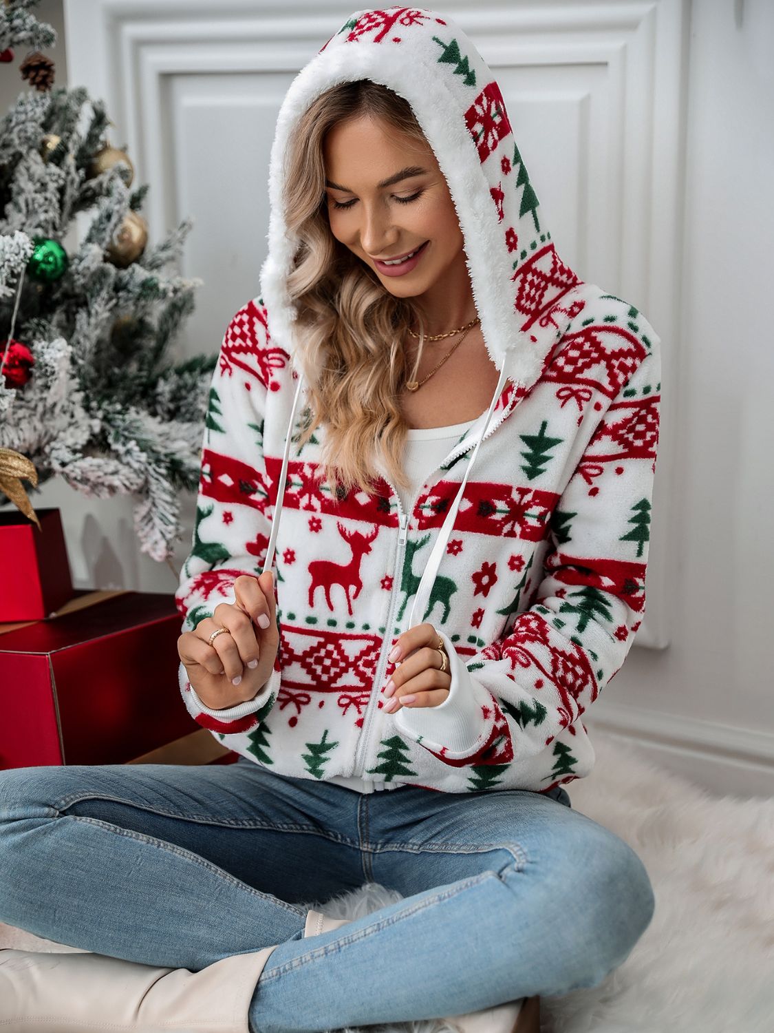 White fleece zip-up hoodie with festive Fair Isle pattern and sherpa-lined hood.