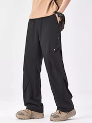Black relaxed fit cargo sweatpants with snap button pockets and a drawstring waist.