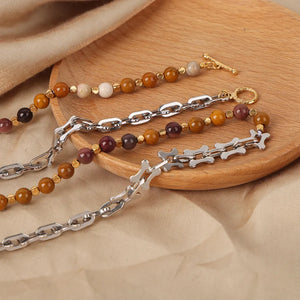 Silver asymmetrical chain necklace with bead and bone details