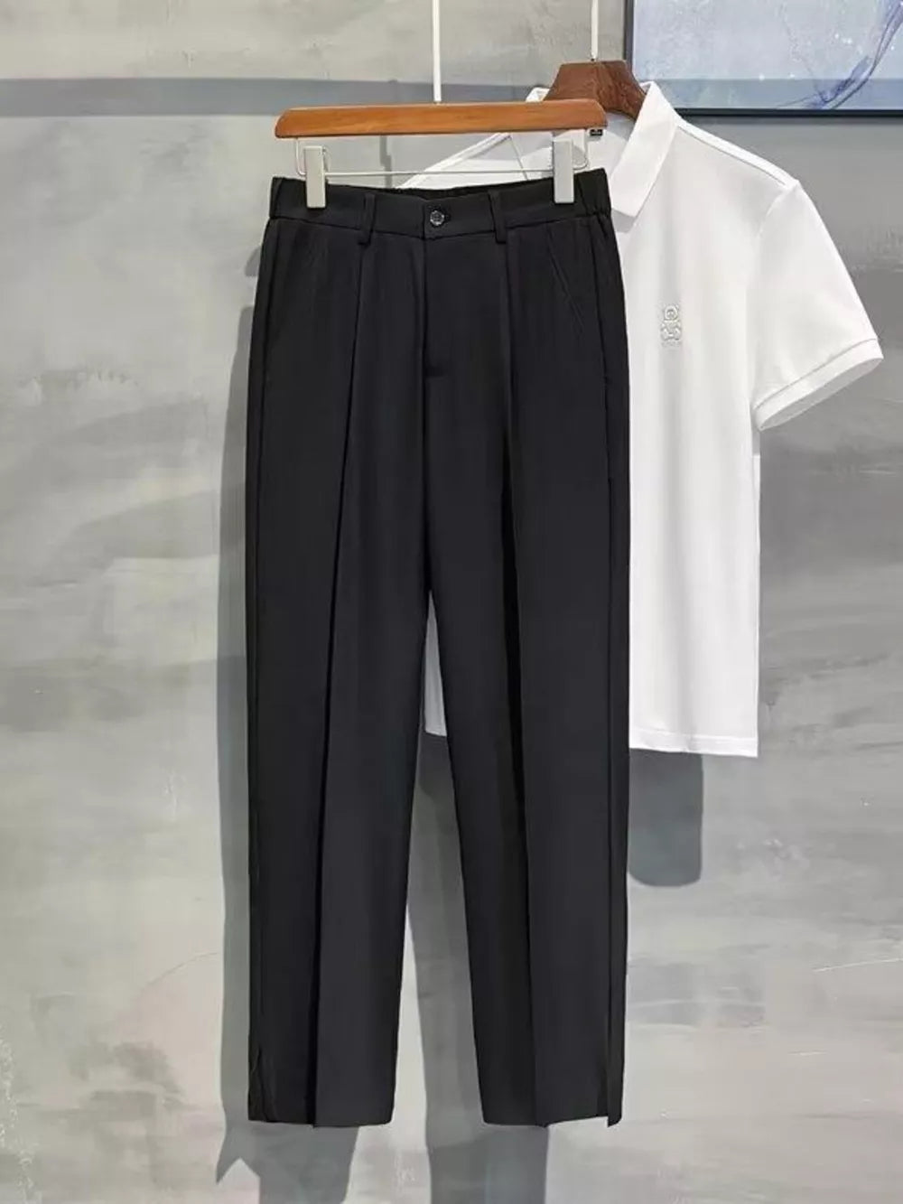 Black men's sweatpants with elevated seam detail and a straight leg cut.