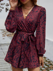 Floral wrap romper in dark brown with blouson sleeves and tie waist