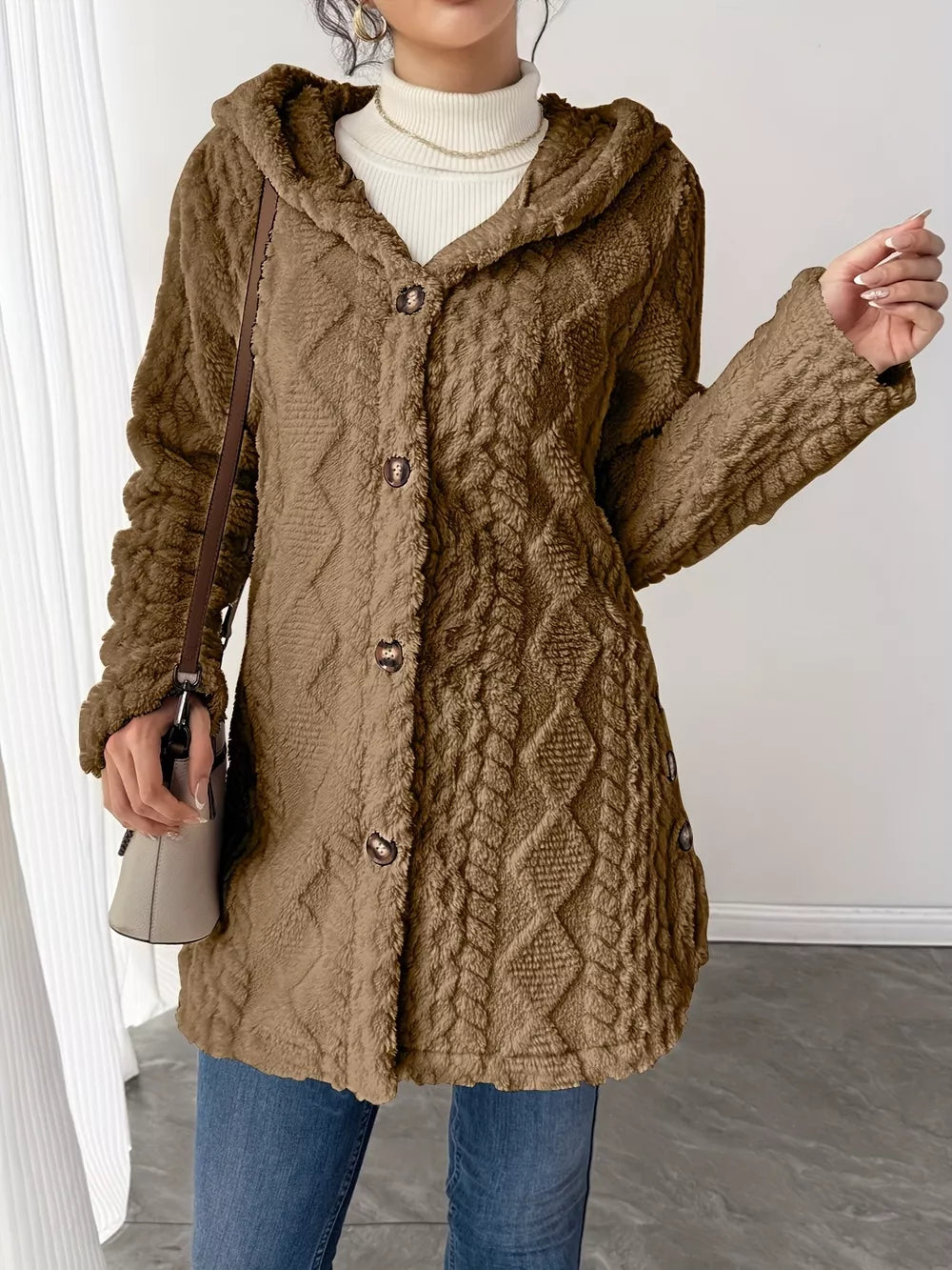 Brown hooded trench coat with cable knit texture and button detail