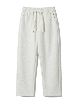 Men's gray heather sweatpants with drawstring and pockets, loose fit.