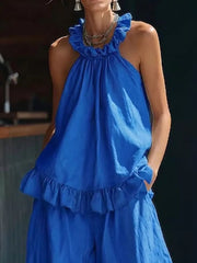 Blue ruffled halter neck top and wide-leg pants set with frill details.