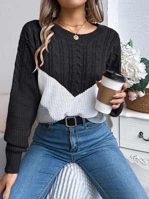 Black and white chevron cable knit sweater with crew neck.