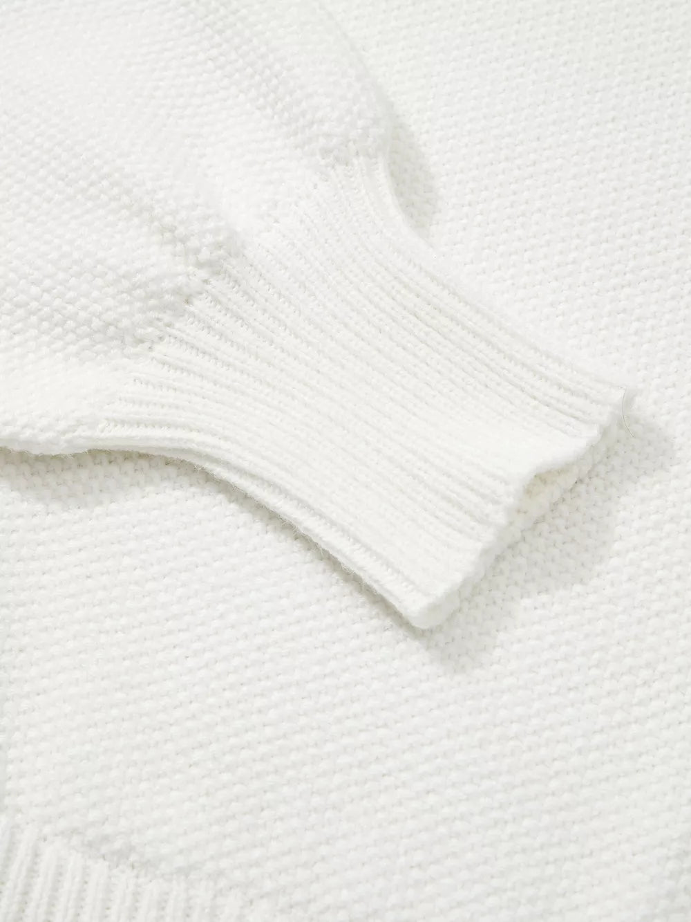 White chenille chunky knit sweater with ribbed cuff detail.