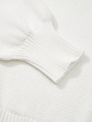 White chenille chunky knit sweater with ribbed cuff detail.