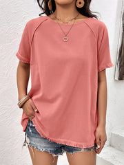 Coral raglan sleeve tee with fringed hem and sleeves.