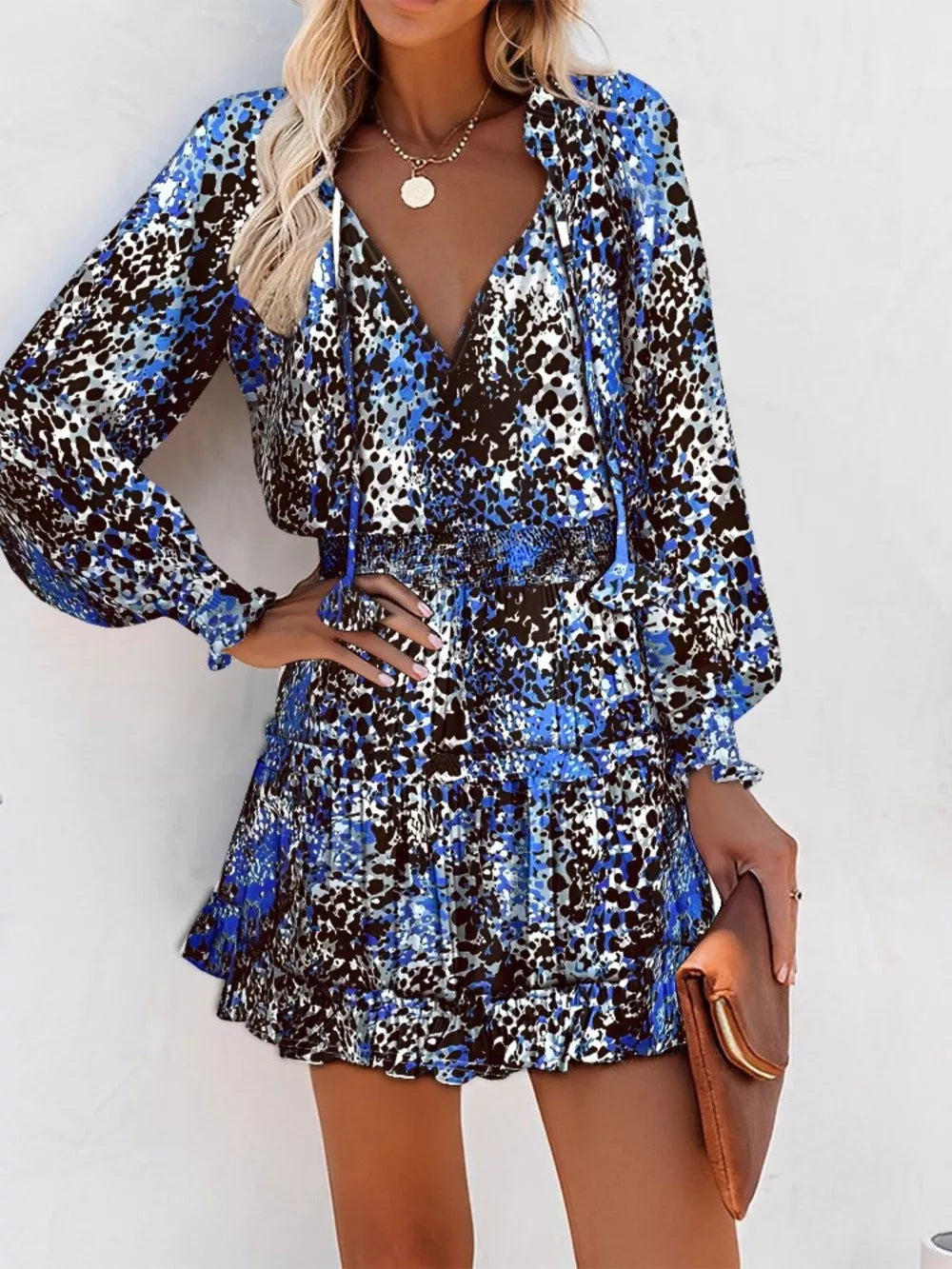 Blue leopard print tiered mini dress with ruffles and long sleeves