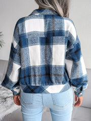 Oversized blue tartan shacket with buttoned cuffs and elasticated hem.