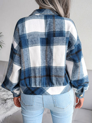 Oversized blue tartan shacket with buttoned cuffs and elasticated hem.