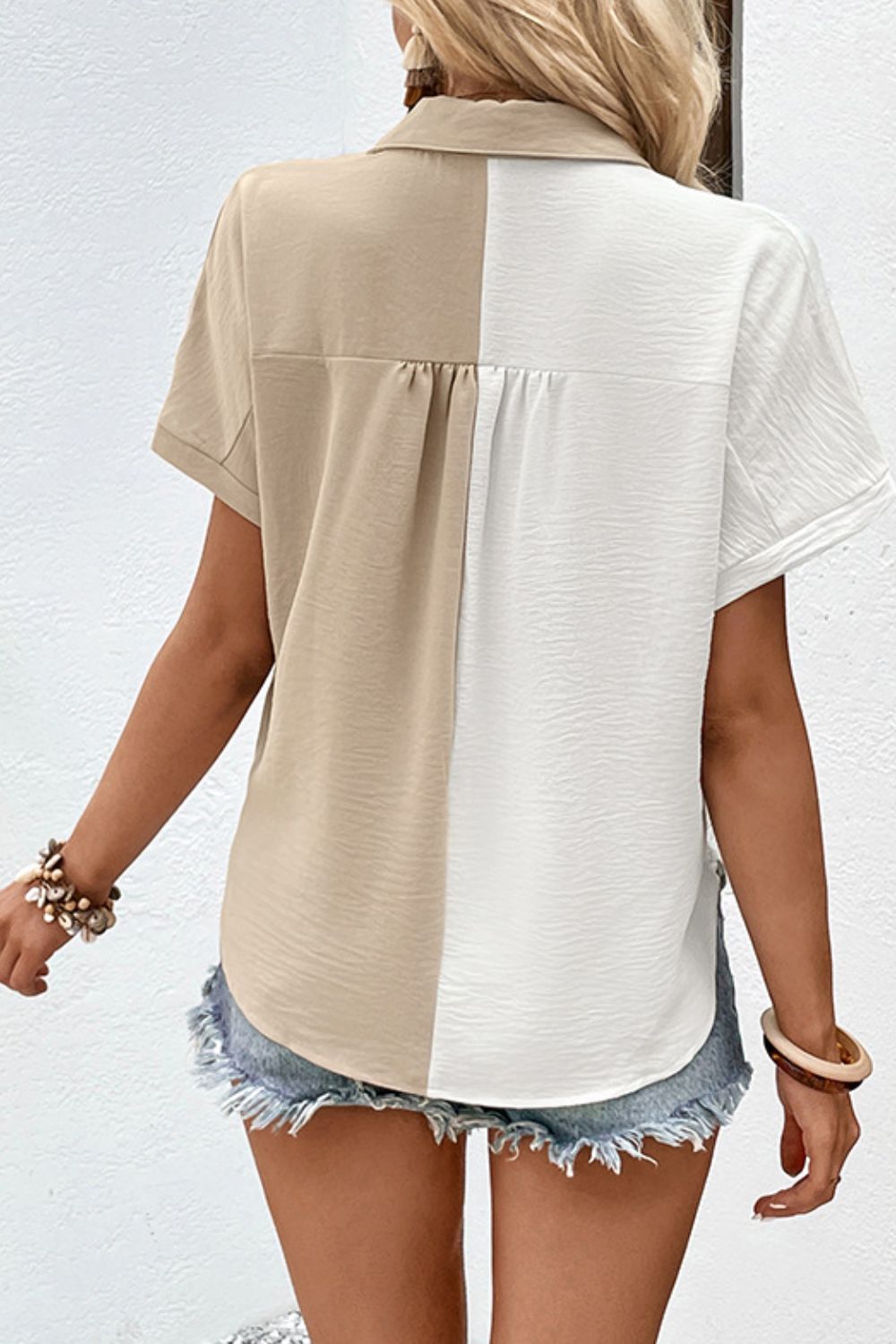Beige colorblock collared shirt with textured finish and short sleeves.