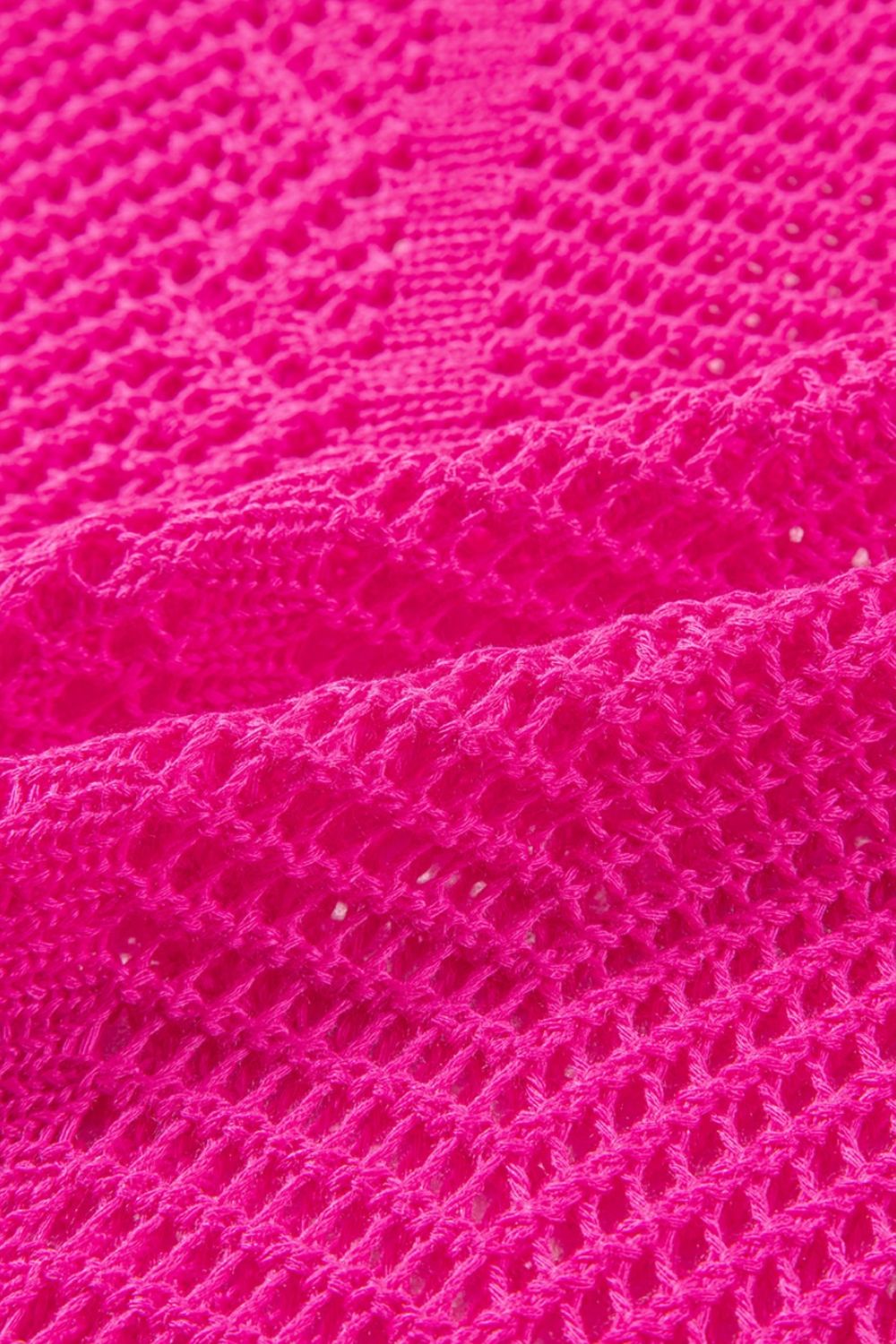 Open-knit chevron sleeve top in hot pink acrylic with a textured stitch pattern.
