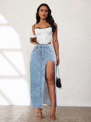 Light blue denim maxi skirt with a high slit and raw hem.