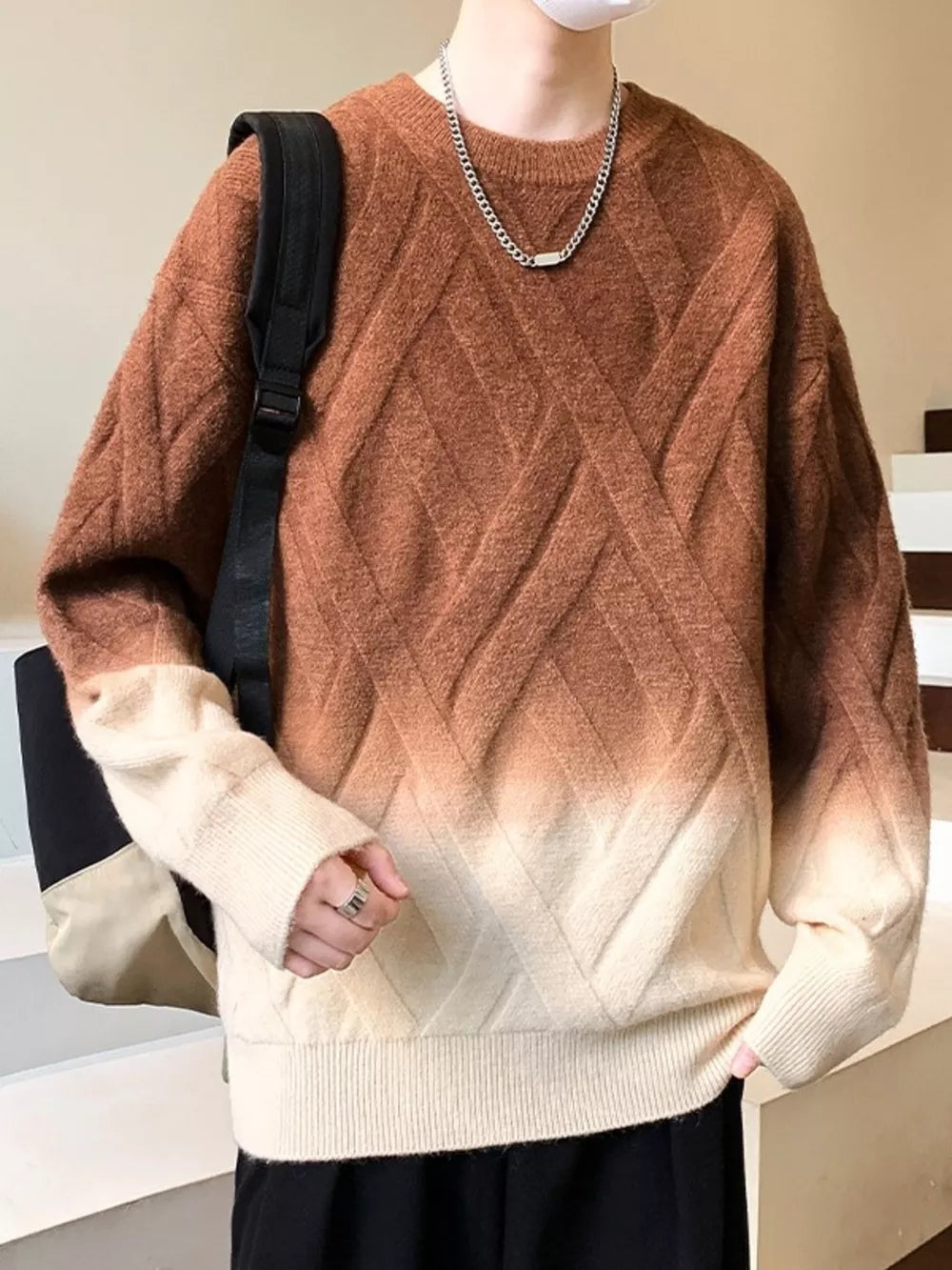 Men's brown and cream gradient knit sweater with lattice design and crew neck.