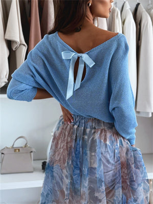 Sky blue knit sweater with off-shoulder neckline and bow-back detail