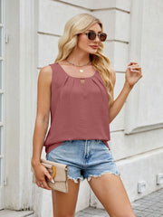 Dusty Pink textured tank top with keyhole neckline and pleats, paired with denim shorts.