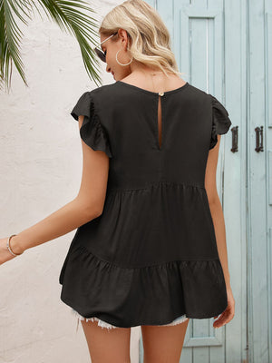 Black babydoll blouse with ruffled short sleeves and tiered hem.