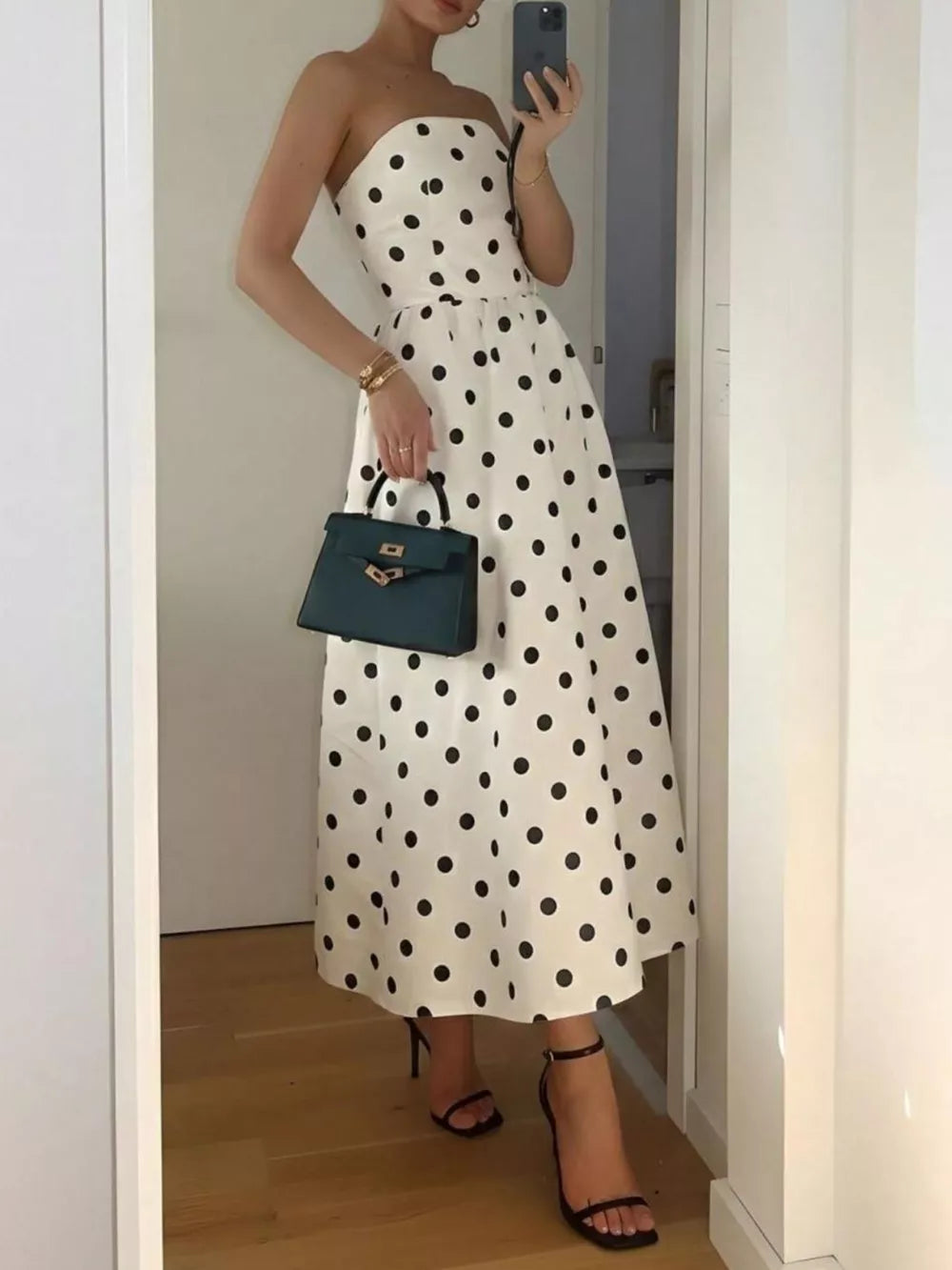 Charming polka dot strapless midi dress in cream polyester, A-line cut.