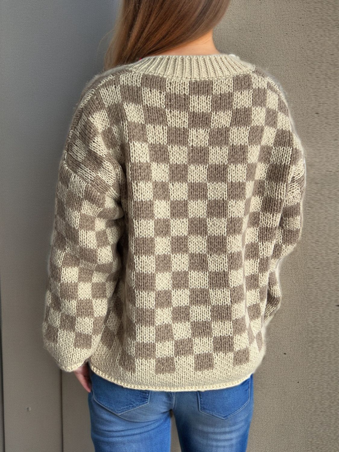 Checkerboard knit button-up cardigan in taupe and cream acrylic with a crew neck.