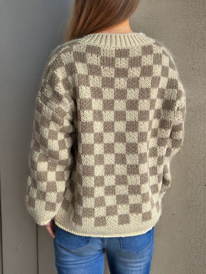 Checkerboard knit button-up cardigan in taupe and cream acrylic with a crew neck.