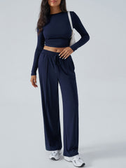Dark blue ribbed knit crop top and wide leg pants set with drawstring waist.