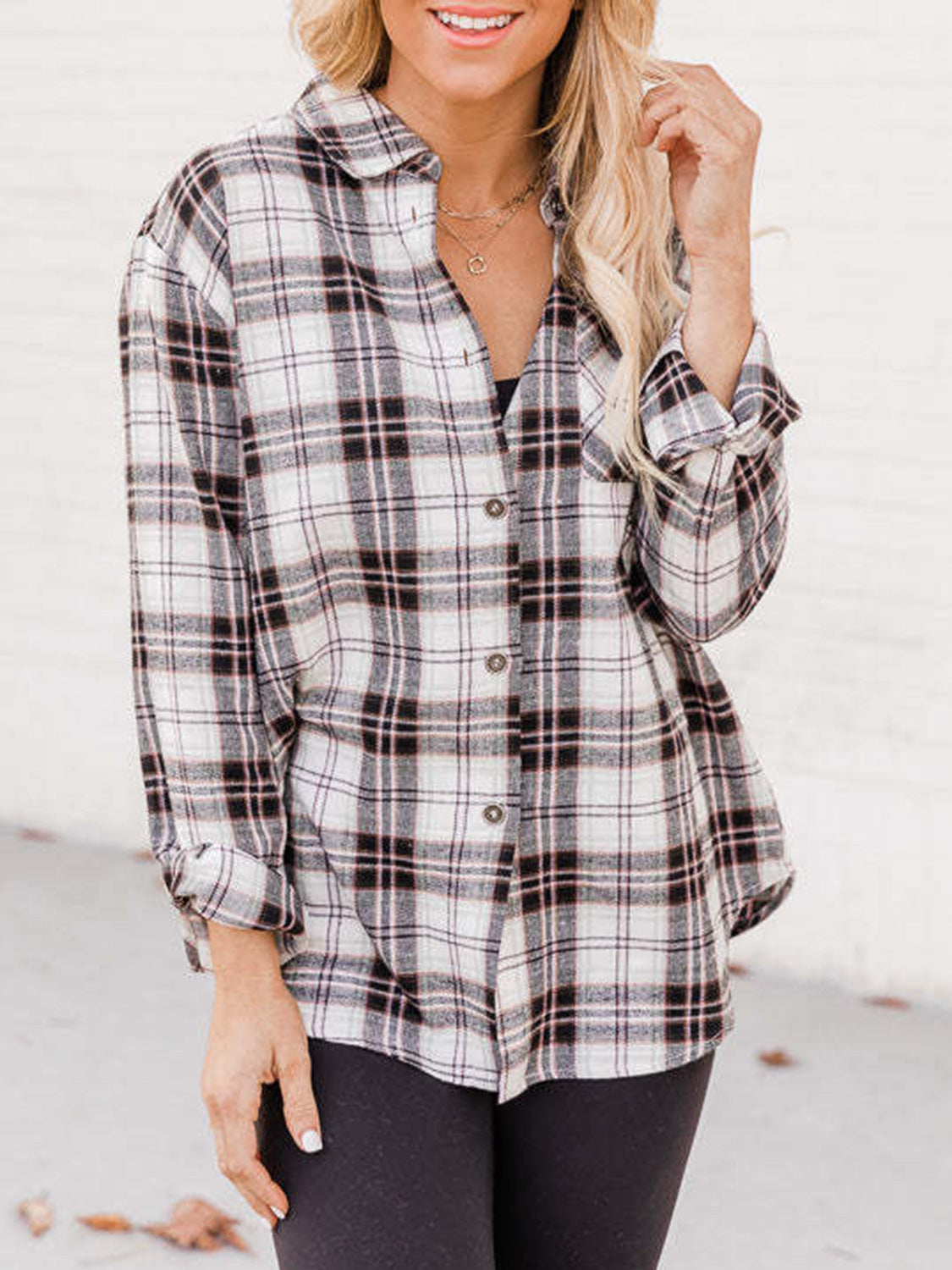 Relaxed fit plaid button-down shirt in white with black and pink plaid.