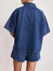 Denim co-ord set in medium wash, featuring a short sleeve utility shirt and matching shorts.