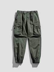Army green cargo joggers with flap pockets and elastic cuffs.