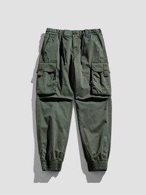 Army green cargo joggers with flap pockets and elastic cuffs.