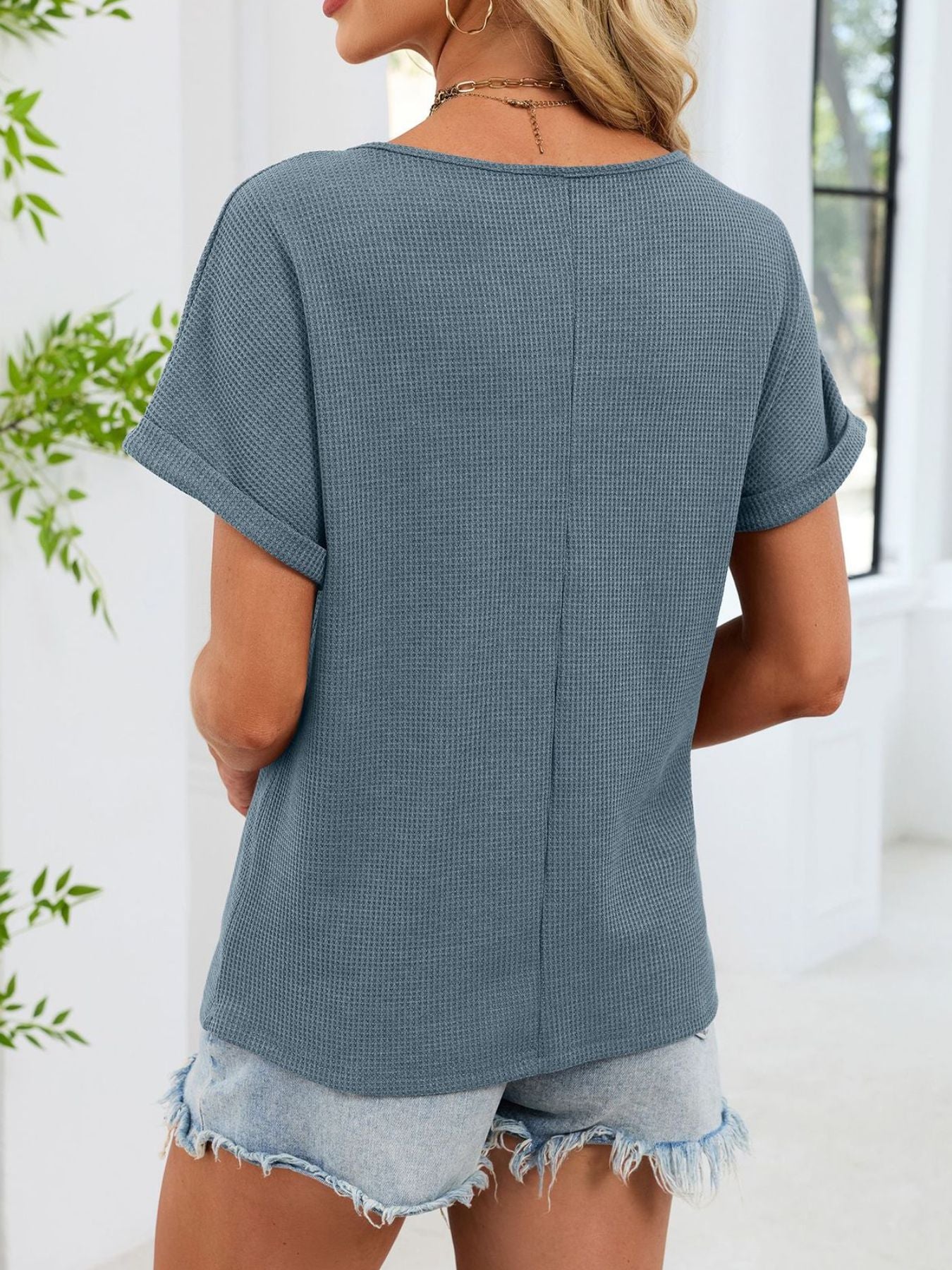 Blue waffle knit short sleeve tee with cuffed sleeves and a relaxed fit.