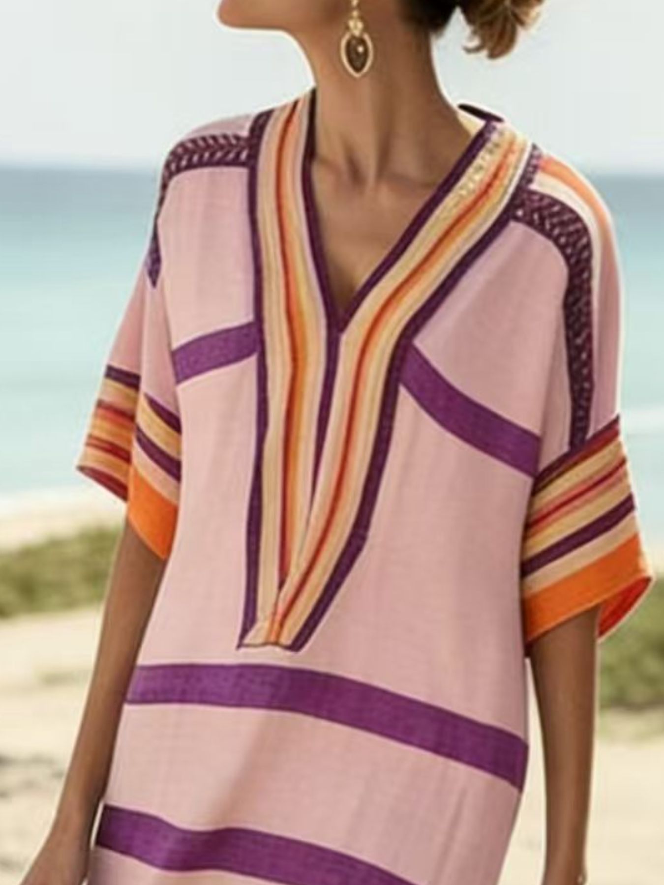 Pink midi dress with colorful stripes and V-neck, half sleeves, beach style