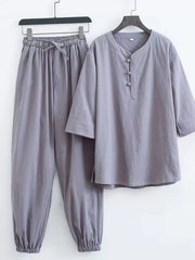 Gray relaxed fit Chinese-inspired men's pants set with drawstring waist and button-up top.