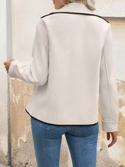 Beige double-breasted bolero jacket with black contrast trim and button details.